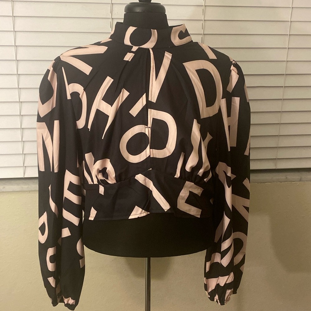 Celure Plus Letter Graphic Cut Out Lantern Sleeve Mock Neck Crop Blouse